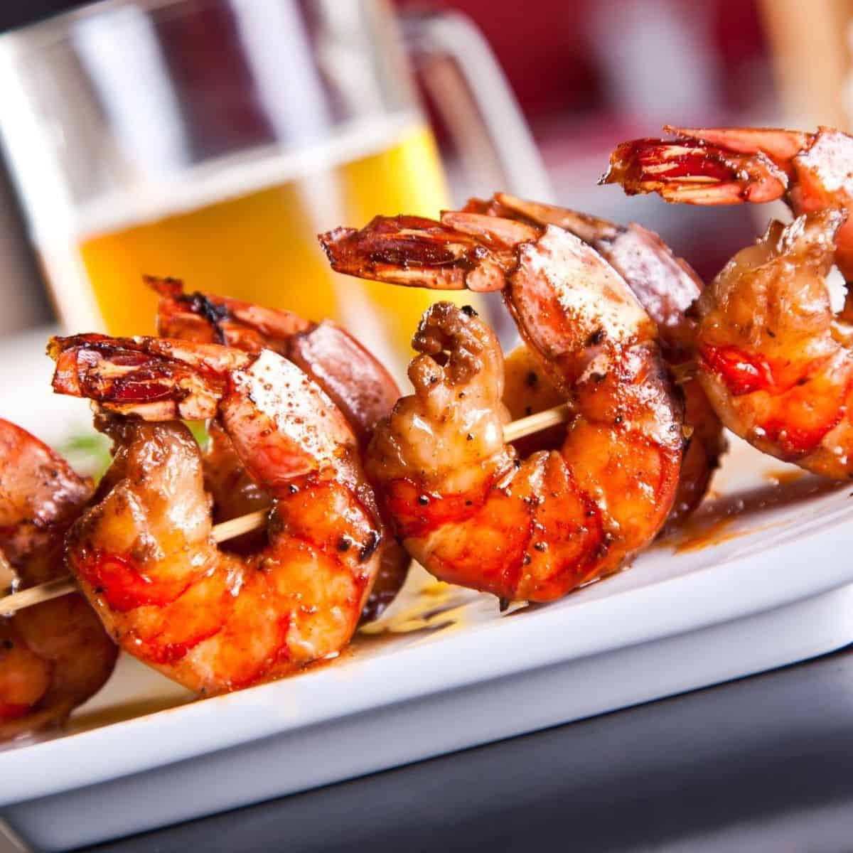 grilled shrimp skewered on a plate