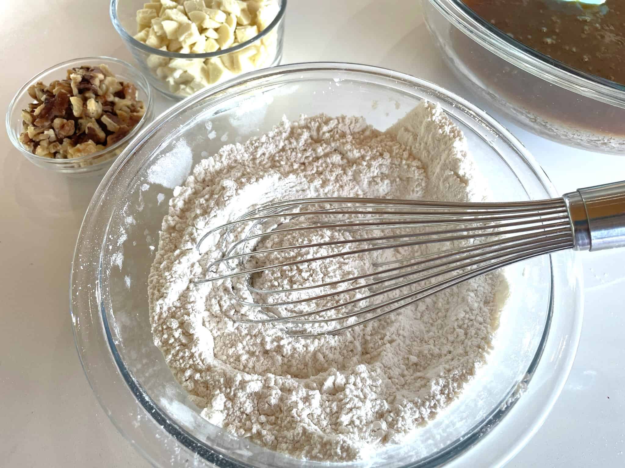 whisking flour salt corn starch and baking powder in a glass bowl