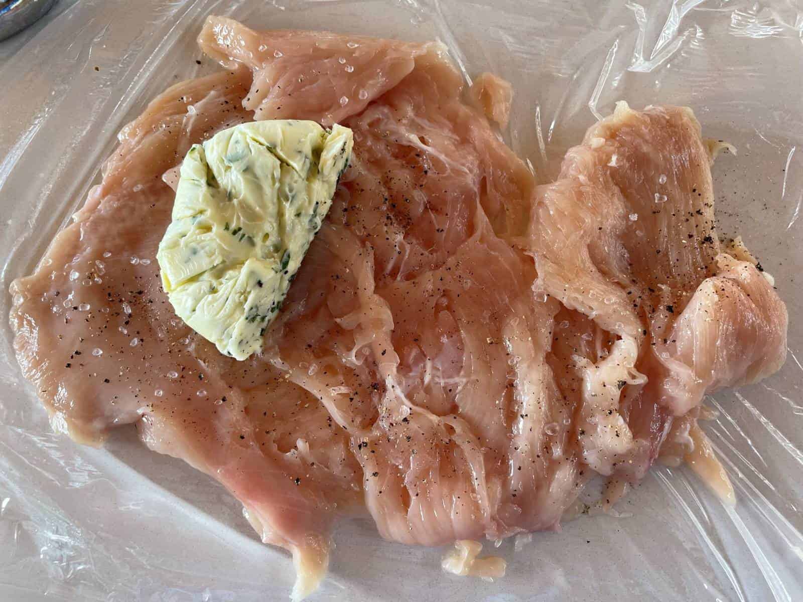 chicken with frozen butter ready to wrap
