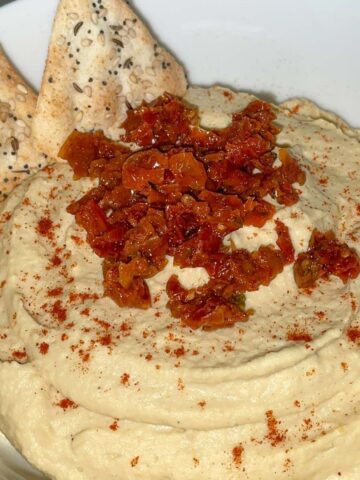 hummus with sun dried tomatoes in a bowl