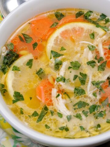 lemon chicken orzo soup in a bowl