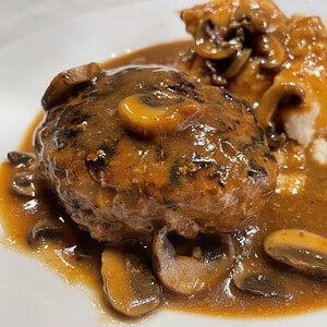 salisbury steak with mushrooms and gravy and mashed potatoes
