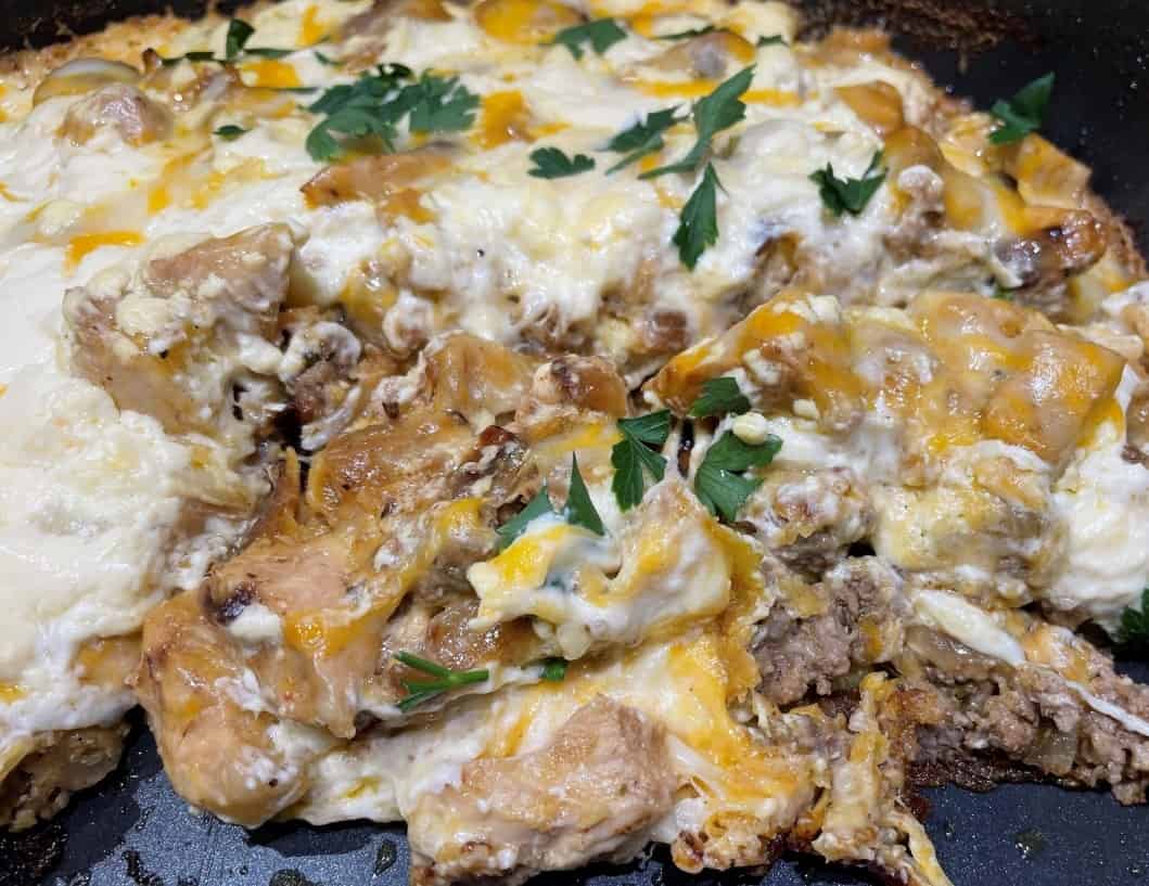 beef and chicken chilaquiles in a pan
