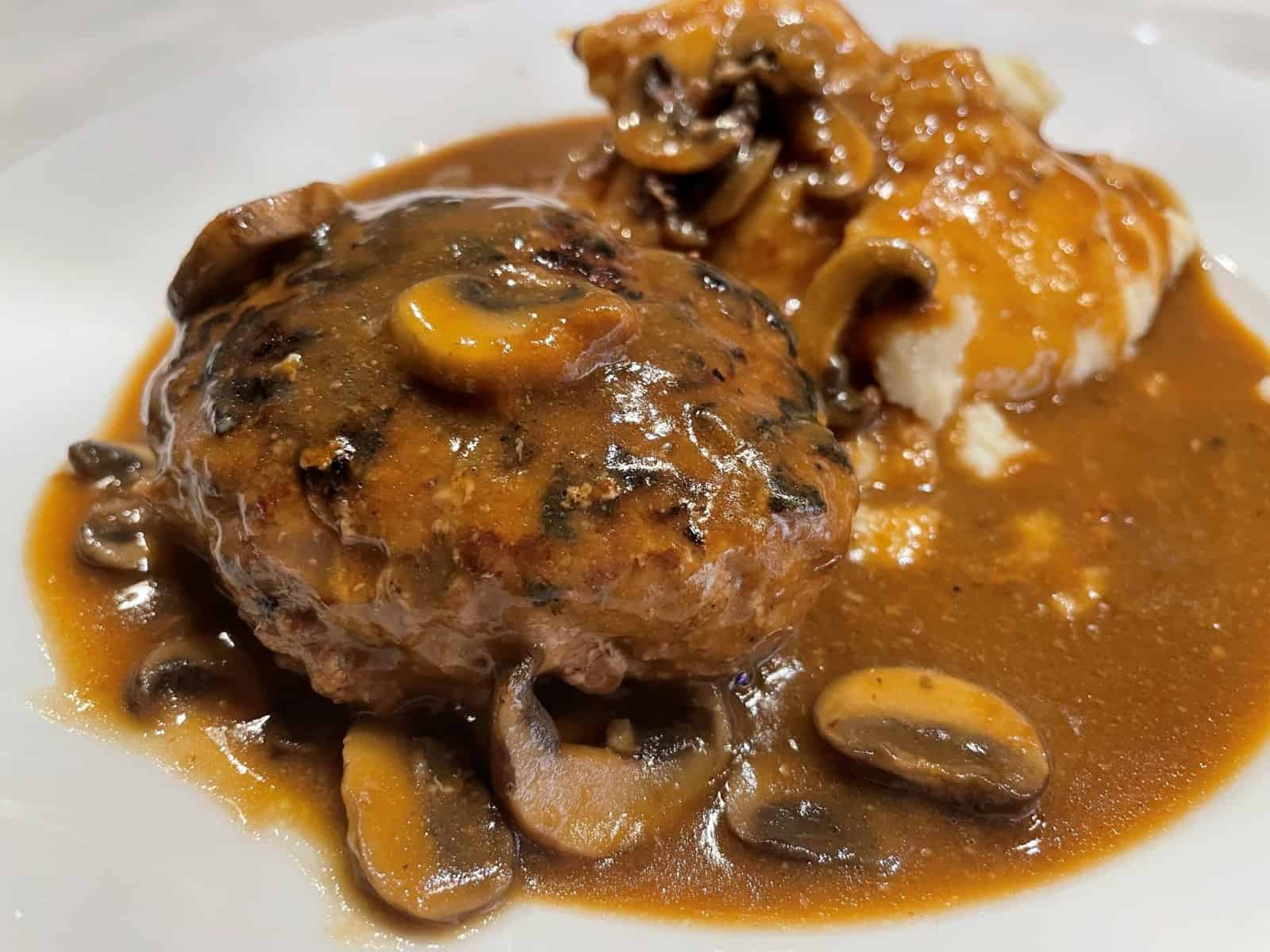 salisbury steak with mushrooms and gravy and mashed potatoes