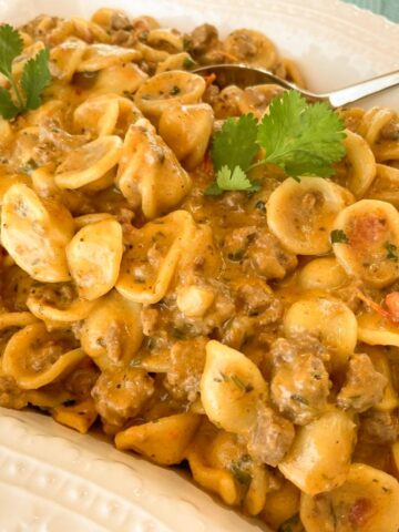 taco pasta casserole seasoned ground beef with a creamy cheesy sauce and pasta