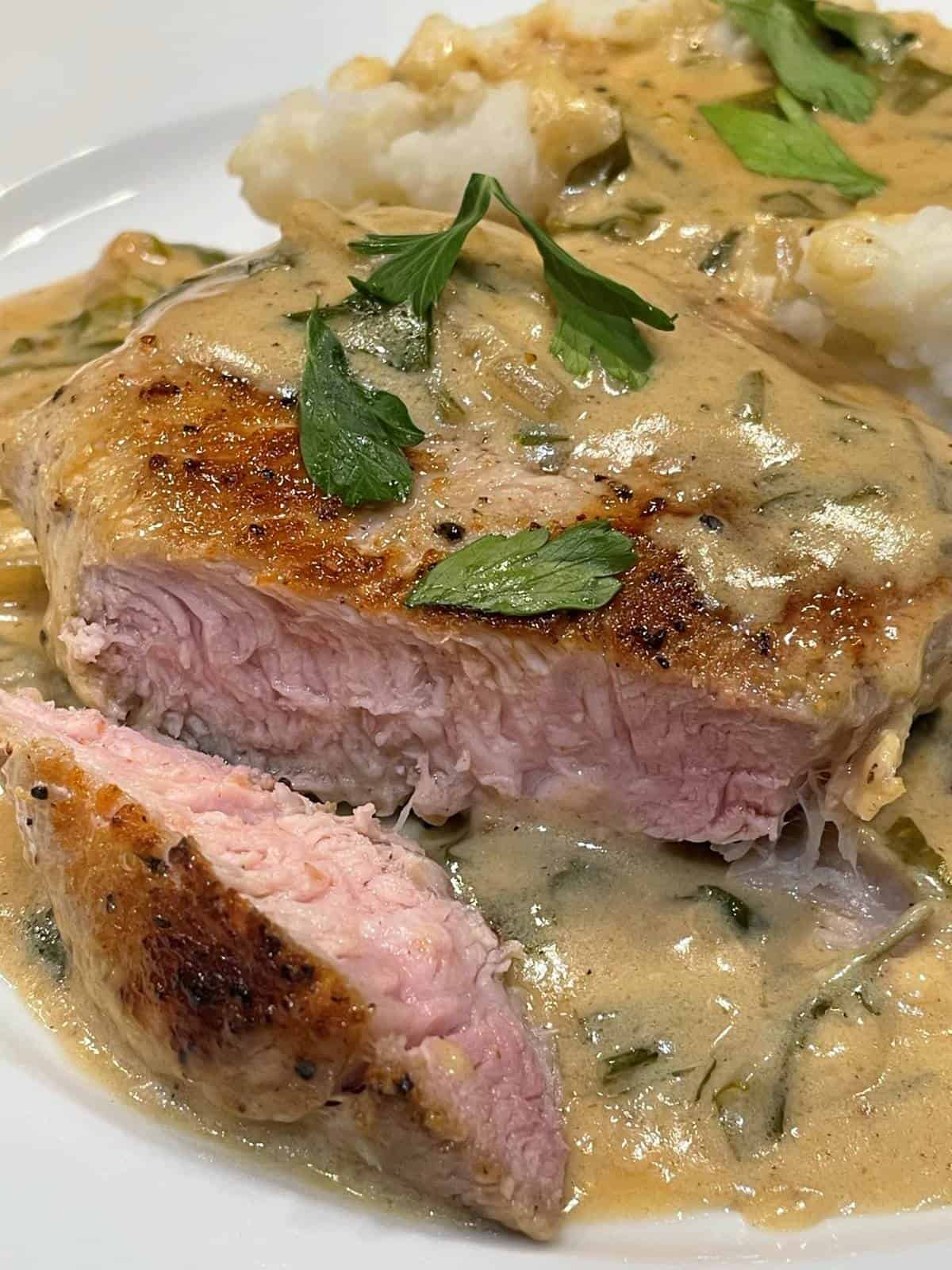 pork chops in sour cream parsley sauce with mashed potatoes
