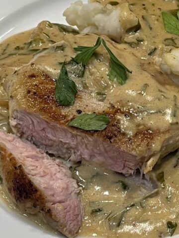 pork chops in sour cream parsley sauce with mashed potatoes