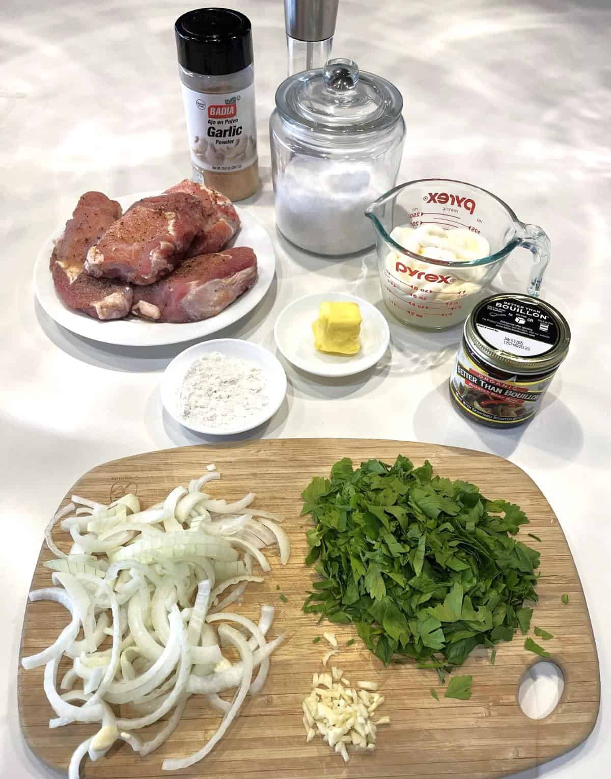 pork chops supreme ingredients onion parsley flour butter bouillon sour cream salt pepper garlic powder pork chops