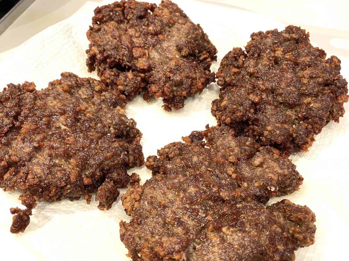 deep fried slugburgers on a plate ready to put on a bun